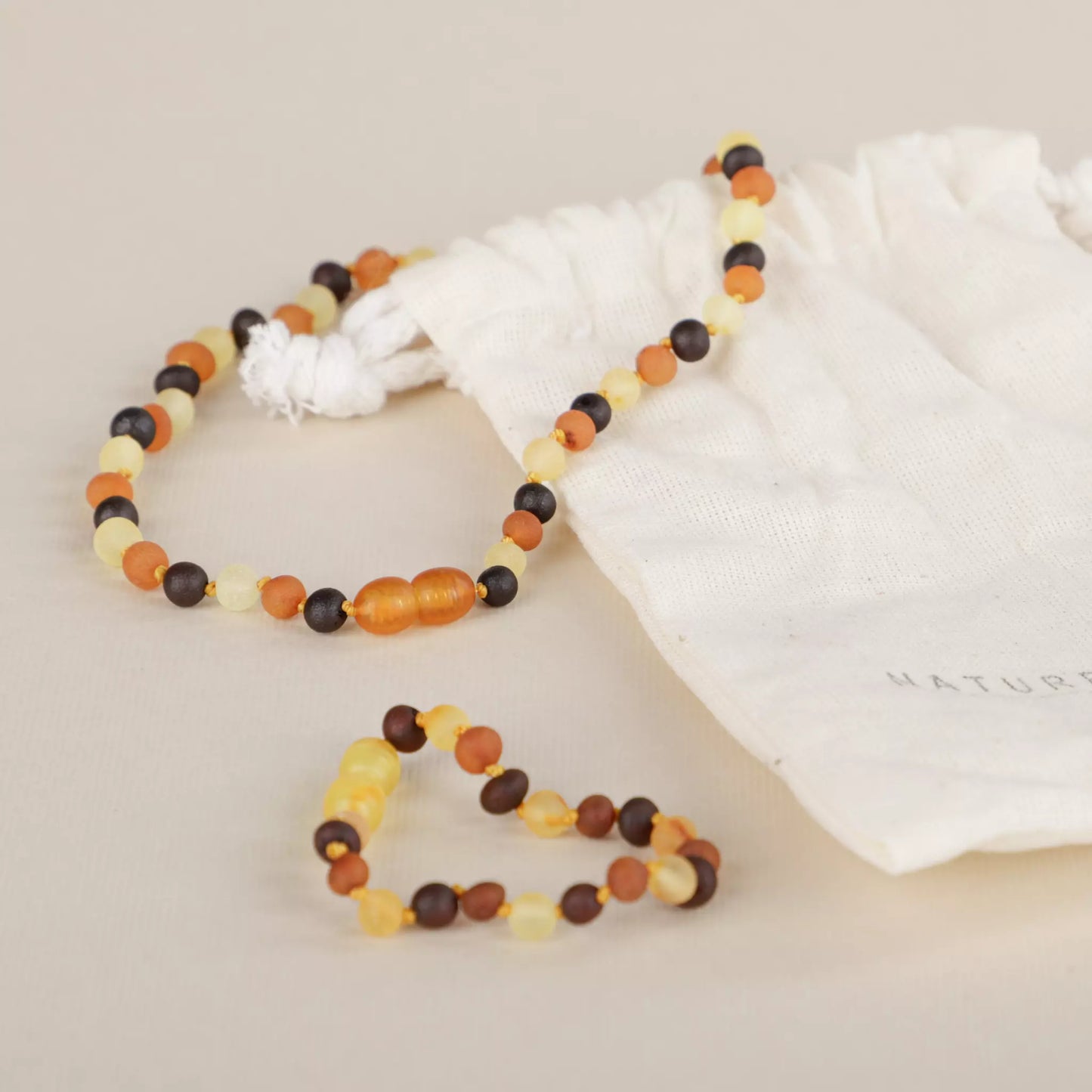 baltic-amber-teething-baby-lunar-mat-naturelmini